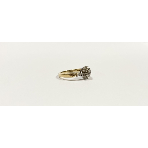 76 - A BEAUTIFUL 9CT YELLOW GOLD DIAMOND CLUSTER RING, with central round cut diamond surrounded by two r... 