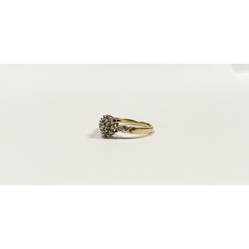 76 - A BEAUTIFUL 9CT YELLOW GOLD DIAMOND CLUSTER RING, with central round cut diamond surrounded by two r... 