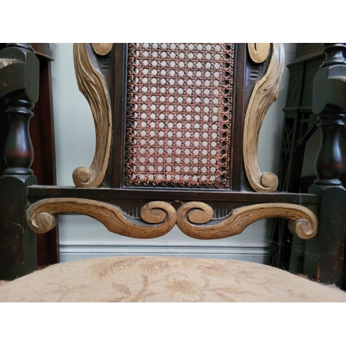 78 - A JACOBEAN REVIVAL STYLE CANE BACKED CARVED ARM CHAIR, the crest rail with beautiful carved Prince o... 