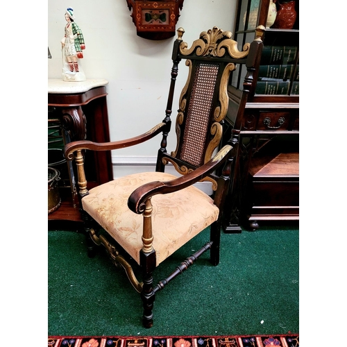 78 - A JACOBEAN REVIVAL STYLE CANE BACKED CARVED ARM CHAIR, the crest rail with beautiful carved Prince o... 