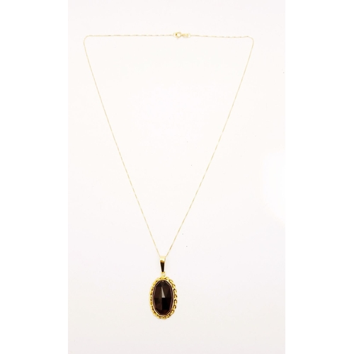 79 - AN ATTRACTIVE 14CT YELLOW GOLD GARNET PENDANT NECKLACE, lovely delicate link chain holds the oval sh... 