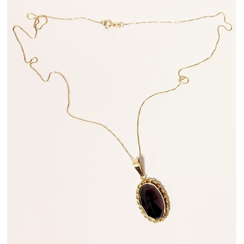 79 - AN ATTRACTIVE 14CT YELLOW GOLD GARNET PENDANT NECKLACE, lovely delicate link chain holds the oval sh... 