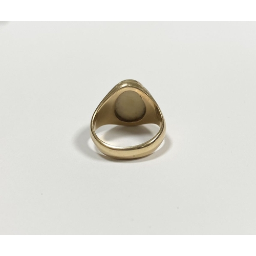 87 - A 14CT YELLOW GOLD ‘D’ ENGRAVED SIGNET RING, with central oval inset carved ‘D’ between fleur de lis... 