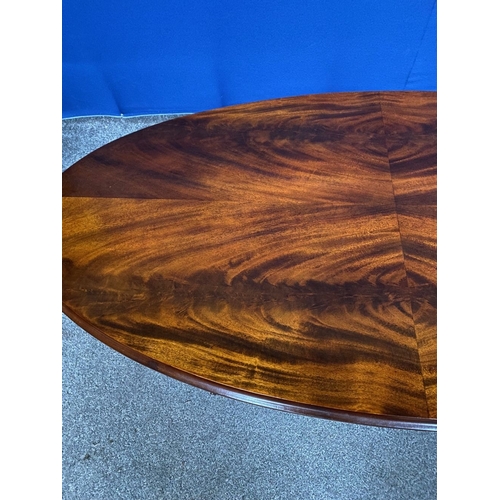 88 - AN OVAL FIGURED MAHOGANY COFFEE TABLE, oval top with molded border, foliate detail to frieze, raised... 