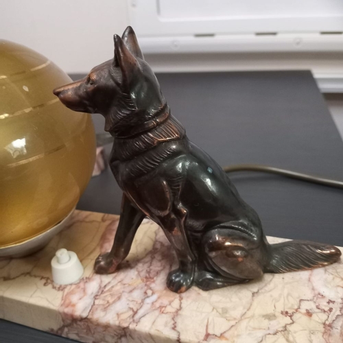 89 - A MATCHED PAIR OF ART DECO BRONZE ON MARBLE TABLE LAMPS, circa 1930s, with seated modelled dogs on a... 