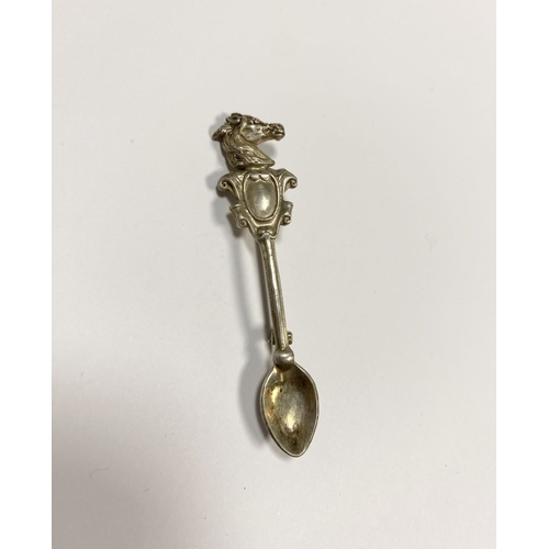 96 - A CHARMING STERLING SILVER SOUVENIR SPOON BROOCH, the handle mounted with blank cartouche below hors... 