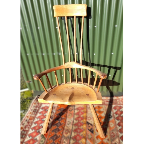 116 - AN EXCELLENT QUALITY HANDMADE ELM ARMCHAIR, in the style of Welsh stick chairs. With narrow four spi... 