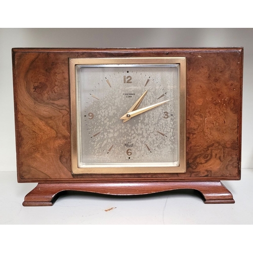 117 - A GOOD QUALITY VINTAGE BURR WALNUT ELLIOTT OF LONDON FOR F. BRENNAN CORK MANTEL CLOCK, a good vintag... 