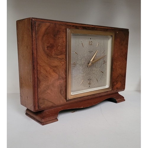 117 - A GOOD QUALITY VINTAGE BURR WALNUT ELLIOTT OF LONDON FOR F. BRENNAN CORK MANTEL CLOCK, a good vintag... 