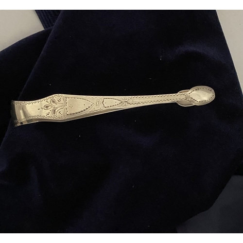 12 - A GEORGE III SILVER SUGAR TONGS, Hallmarked London c.1792, makers marks rubbed. Featuring intricate ... 