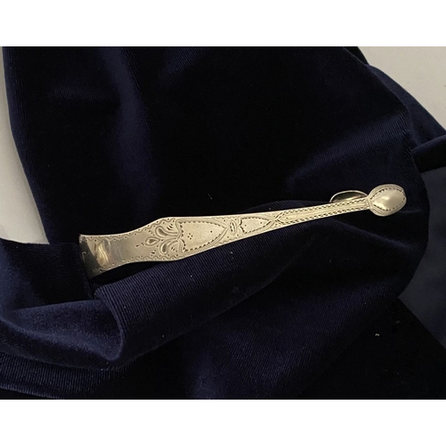 12 - A GEORGE III SILVER SUGAR TONGS, Hallmarked London c.1792, makers marks rubbed. Featuring intricate ... 