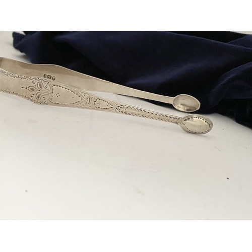 12 - A GEORGE III SILVER SUGAR TONGS, Hallmarked London c.1792, makers marks rubbed. Featuring intricate ... 