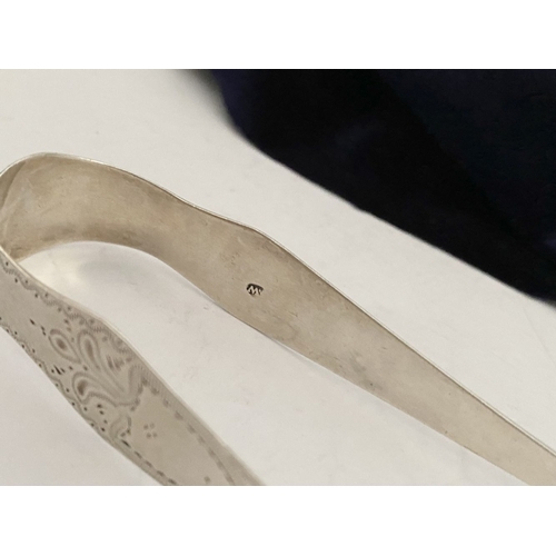 12 - A GEORGE III SILVER SUGAR TONGS, Hallmarked London c.1792, makers marks rubbed. Featuring intricate ... 