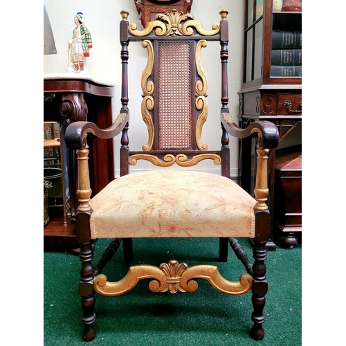 124 - A JACOBEAN REVIVAL STYLE CANE BACKED CARVED ARM CHAIR, the crest rail with beautiful carved Prince o... 