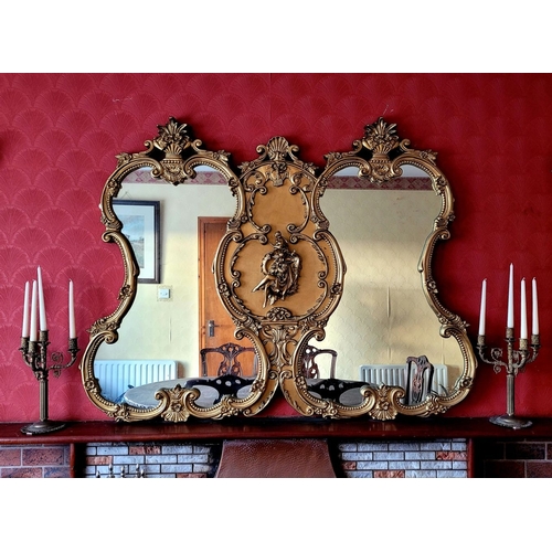 136 - AN EXCEPTIONAL DOUBLE PANE GILT OVER MANTLE, with raised relief panel to the centre depicting a seat... 