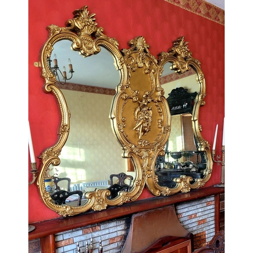 136 - AN EXCEPTIONAL DOUBLE PANE GILT OVER MANTLE, with raised relief panel to the centre depicting a seat... 