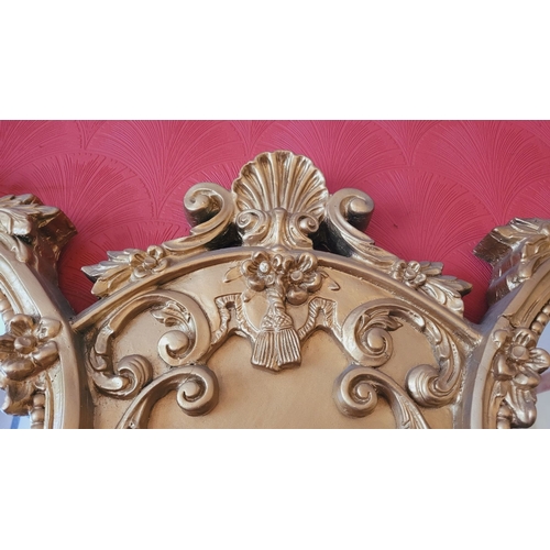 136 - AN EXCEPTIONAL DOUBLE PANE GILT OVER MANTLE, with raised relief panel to the centre depicting a seat... 