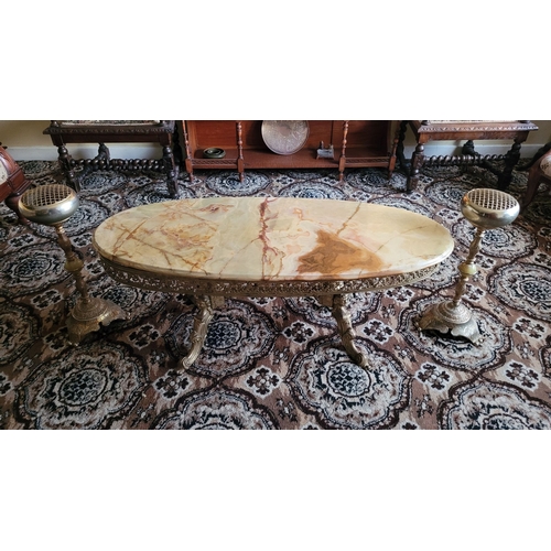 141 - A VINTAGE RARE ONYX TOPPED BRASS COFFEE TABLE, the oval shaped table has single piece of mottled gre... 