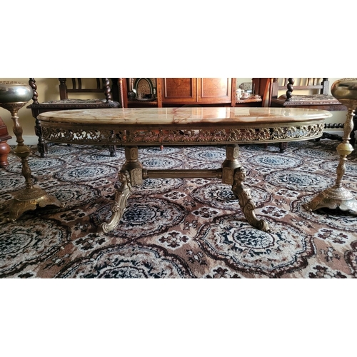 141 - A VINTAGE RARE ONYX TOPPED BRASS COFFEE TABLE, the oval shaped table has single piece of mottled gre... 