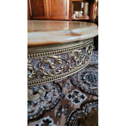 141 - A VINTAGE RARE ONYX TOPPED BRASS COFFEE TABLE, the oval shaped table has single piece of mottled gre... 