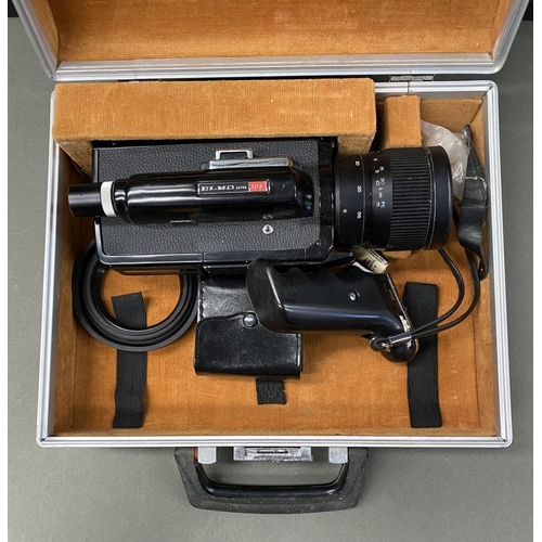 180 - A VINTAGE CASED ELMO SUPER 108 CAMERA, complete with lenses and attachments as photographed.