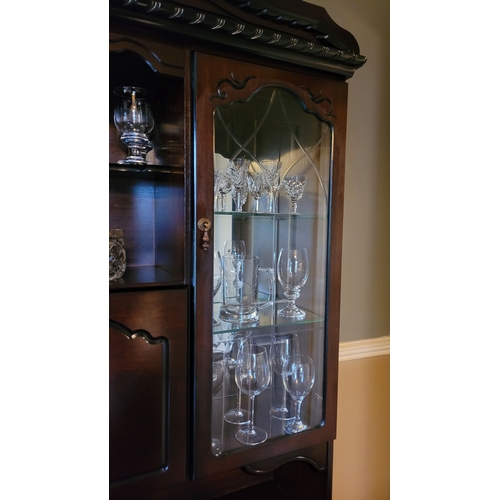 187 - A 20TH CENTURY GLAZED DISPLAY CASE UNIT, with a shaped pediment top over an open shelved section to ... 