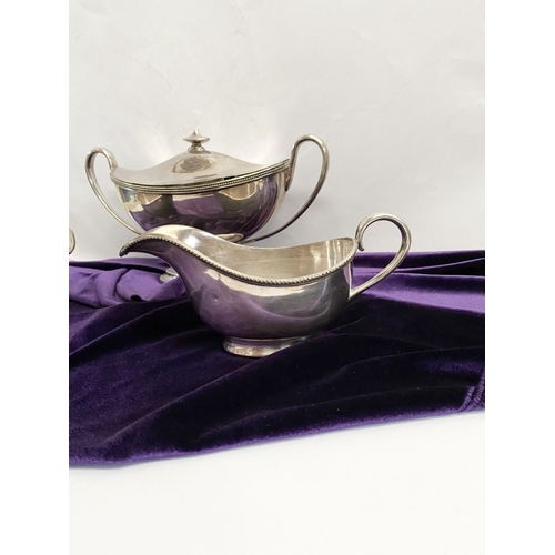 189 - A VINTAGE SILVER PLATED TUREEN AND PAIR OF SAUCE BOATS, each with beaded border to rim, the tureen w... 