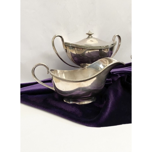 189 - A VINTAGE SILVER PLATED TUREEN AND PAIR OF SAUCE BOATS, each with beaded border to rim, the tureen w... 