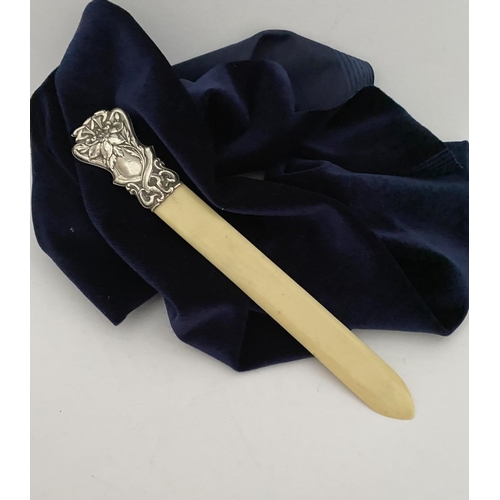 19 - AN ART NOUVEAU SILVER MOUNTED PAPER KNIFE/LETTER OPENER, c.1902. The silver mount with intricate Art... 