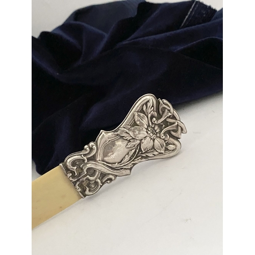 19 - AN ART NOUVEAU SILVER MOUNTED PAPER KNIFE/LETTER OPENER, c.1902. The silver mount with intricate Art... 