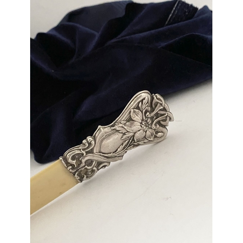 19 - AN ART NOUVEAU SILVER MOUNTED PAPER KNIFE/LETTER OPENER, c.1902. The silver mount with intricate Art... 