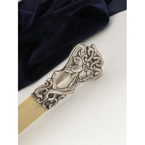 19 - AN ART NOUVEAU SILVER MOUNTED PAPER KNIFE/LETTER OPENER, c.1902. The silver mount with intricate Art... 