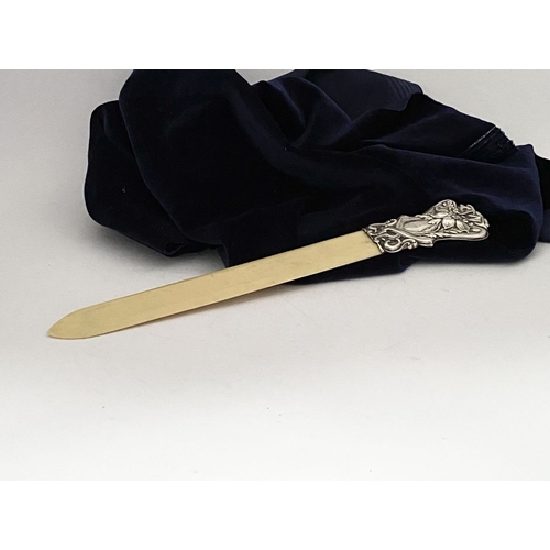 19 - AN ART NOUVEAU SILVER MOUNTED PAPER KNIFE/LETTER OPENER, c.1902. The silver mount with intricate Art... 