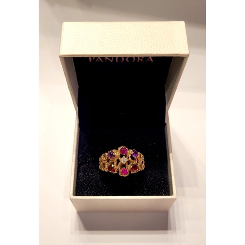 20 - AN EYE CATCHING 9CT YELLOW GOLD MULTI STONE CLUSTER / COCKTAIL RING, with pierced band & shank set w... 