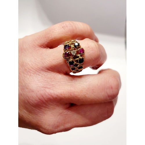 20 - AN EYE CATCHING 9CT YELLOW GOLD MULTI STONE CLUSTER / COCKTAIL RING, with pierced band & shank set w... 