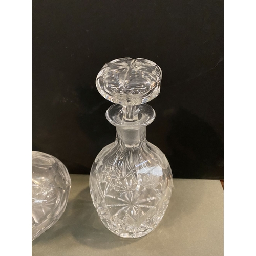 214 - A COLLECTION OF CUT GLASS DECANTERS & PAIR OF KNIFE RESTS, the decanters of various forms with a var... 