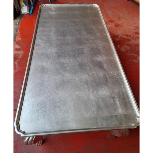 215 - A LARGE SILVER PAINTED COFFEE TABLE, with raised gallery border to top, raised on shaped fluted legs... 