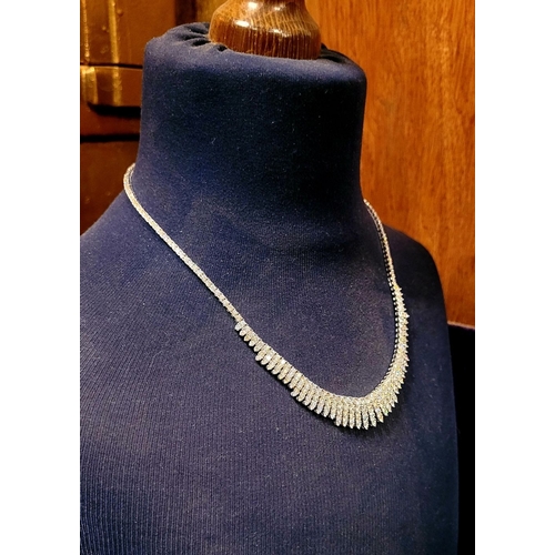 24 - A STUNNING 18CT WHITE GOLD DIAMOND ENCRUSTED FRINGE STYLE NECKLACE, encrusted with approximately 26c... 