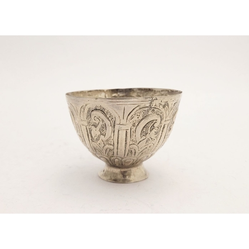 32 - AN ANTIQUE SILVER BOWL, possibly Indian, decorated with a floral panel design to the outside, raised... 