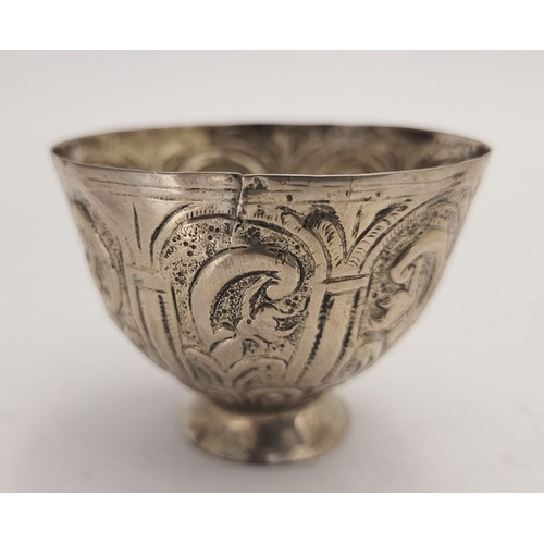 32 - AN ANTIQUE SILVER BOWL, possibly Indian, decorated with a floral panel design to the outside, raised... 