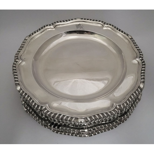 4 - A RARE & EXCEPTIONAL SET OF 12 GEORGIAN SILVER DINNER PLATES, each with a scalloped rim decorated wi... 