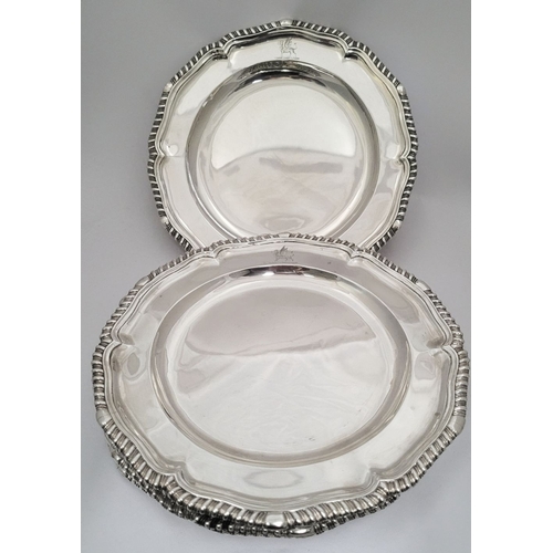 4 - A RARE & EXCEPTIONAL SET OF 12 GEORGIAN SILVER DINNER PLATES, each with a scalloped rim decorated wi... 