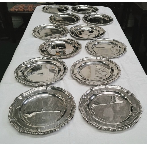 4 - A RARE & EXCEPTIONAL SET OF 12 GEORGIAN SILVER DINNER PLATES, each with a scalloped rim decorated wi... 