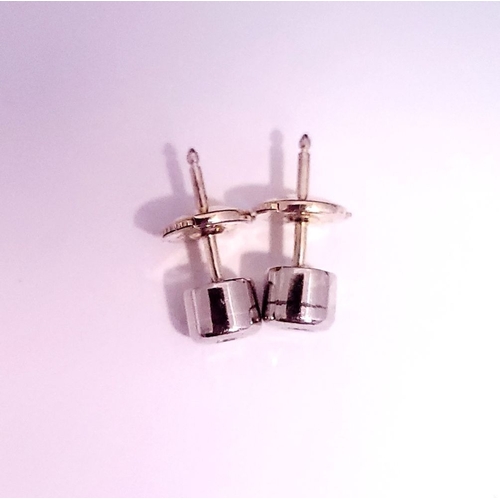 48 - A PAIR OF DIAMOND STUD EARRINGS each in a roll-over cylindrical column setting, with ALPA secure bac... 