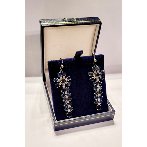 50 - A FANTASTIC PAIR OF WHITE GOLD BLUE SAPPHIRE & DIAMOND DROP EARRINGS, each with a starburst style de... 