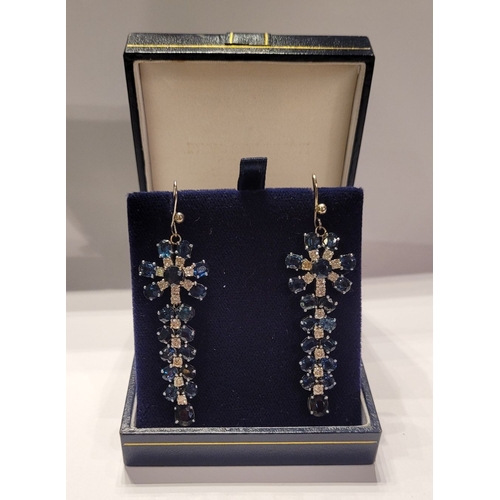 50 - A FANTASTIC PAIR OF WHITE GOLD BLUE SAPPHIRE & DIAMOND DROP EARRINGS, each with a starburst style de... 