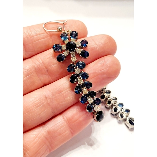 50 - A FANTASTIC PAIR OF WHITE GOLD BLUE SAPPHIRE & DIAMOND DROP EARRINGS, each with a starburst style de... 