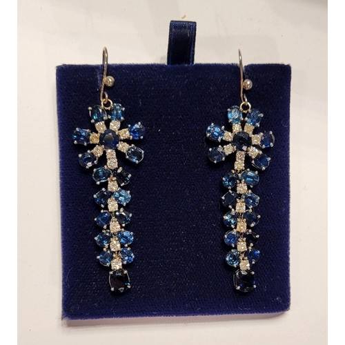 50 - A FANTASTIC PAIR OF WHITE GOLD BLUE SAPPHIRE & DIAMOND DROP EARRINGS, each with a starburst style de... 