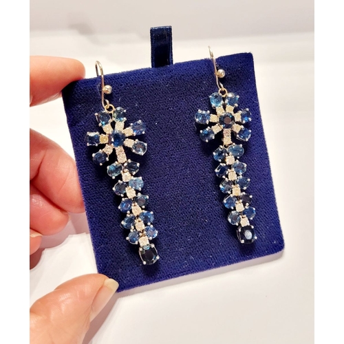 50 - A FANTASTIC PAIR OF WHITE GOLD BLUE SAPPHIRE & DIAMOND DROP EARRINGS, each with a starburst style de... 