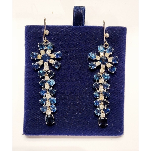 50 - A FANTASTIC PAIR OF WHITE GOLD BLUE SAPPHIRE & DIAMOND DROP EARRINGS, each with a starburst style de... 